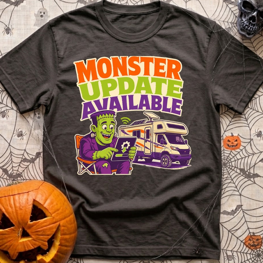 Beast Update Pending - T-Shirt in Graphite - A cartoon illustration of Frankenstein's monster sitting in a camp chair,...