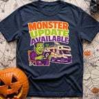 Beast Update Pending - T-Shirt in Navy - A cartoon illustration of Frankenstein's monster sitting in a camp chair,...