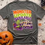 Beast Update Pending - T-Shirt in Pepper - A cartoon illustration of Frankenstein's monster sitting in a camp chair,...