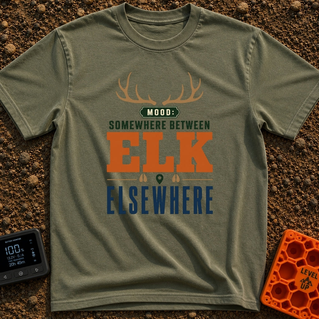 Between Elk And Elsewhere - T-Shirt in Moss - A typographic design featuring a pair of elk antlers at the top above the...