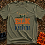 Between Elk And Elsewhere - T-Shirt in Moss - A typographic design featuring a pair of elk antlers at the top above the...