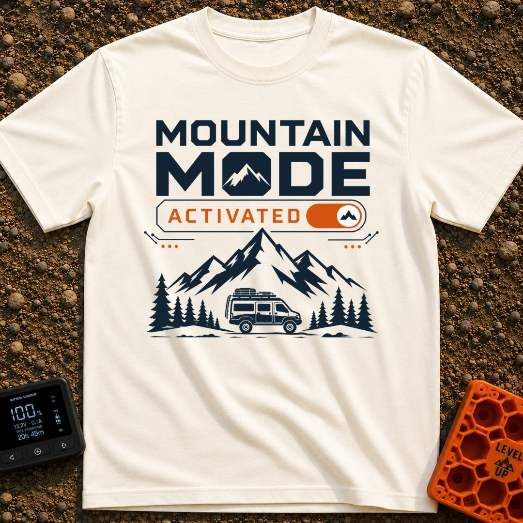 Mountain Mode On - T-Shirt in Ivory - The design features bold text reading "MOUNTAIN MODE" above an orange digital...