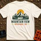 Peak View Upgrade - T-Shirt in Ivory - A graphical illustration of a Class C motorhome parked in front of a pine forest...