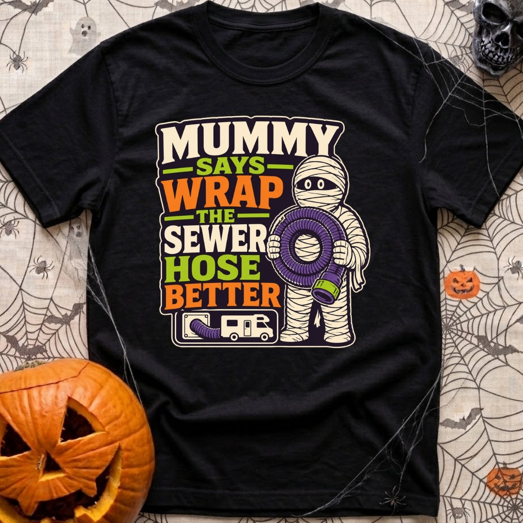 Mummy Says Wrap It - T-Shirt in Black - A cartoon illustration of a mummy holding a coiled purple RV sewer hose,...