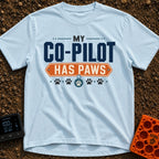 My Copilot Has Paws - T-Shirt in Chambray - A typography-based design featuring the text 'MY CO-PILOT' in large blue...