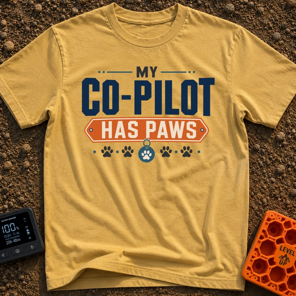 My Copilot Has Paws - T-Shirt in Mustard - A typography-based design featuring the text 'MY CO-PILOT' in large blue...