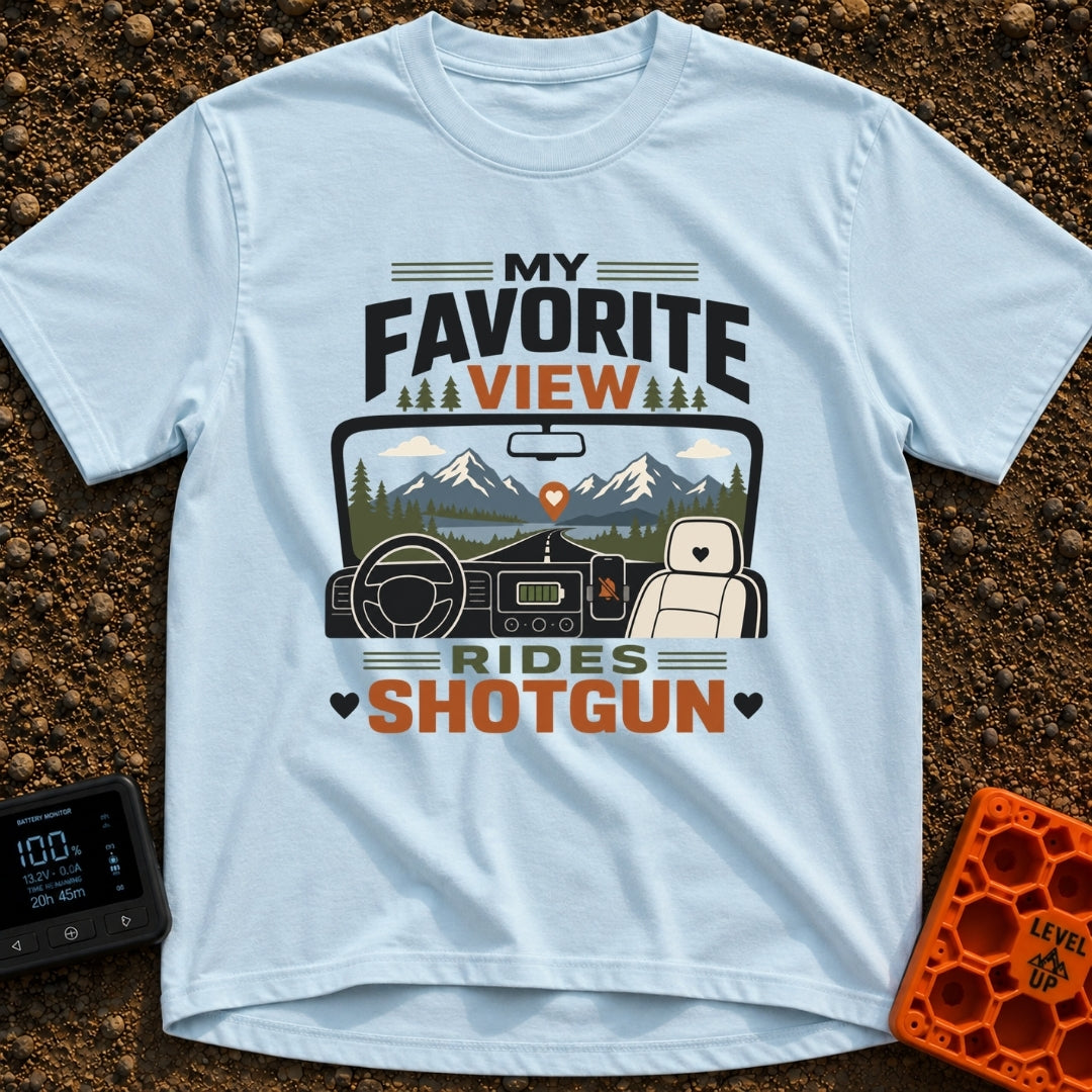 Front Seat Views - T-Shirt in Chambray - A view from inside a vehicle looking out the windshield at a road leading to...