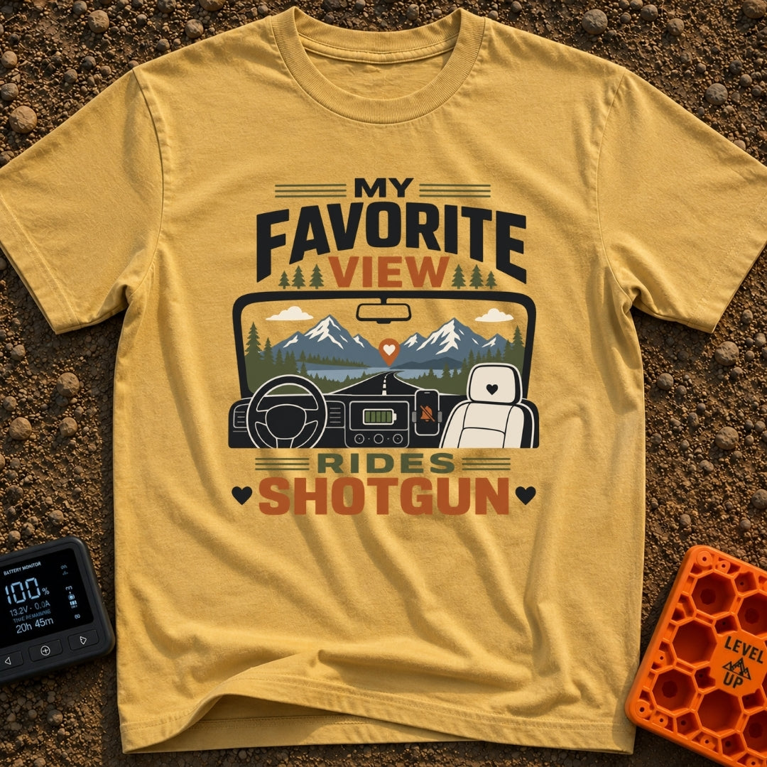 Front Seat Views - T-Shirt in Mustard - A view from inside a vehicle looking out the windshield at a road leading to...