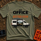 Office With A View - T-Shirt in Moss - A white camper van with a roof-mounted solar panel and an open sliding door...
