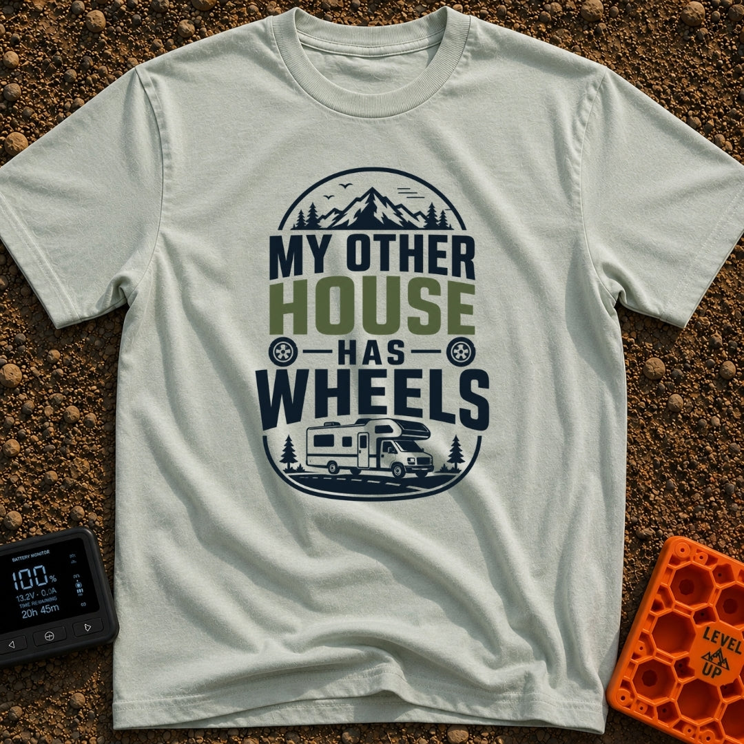 My Other House Rolls - T-Shirt in Bay - A typographic badge design reading 'MY OTHER HOUSE HAS WHEELS' featuring stylized...