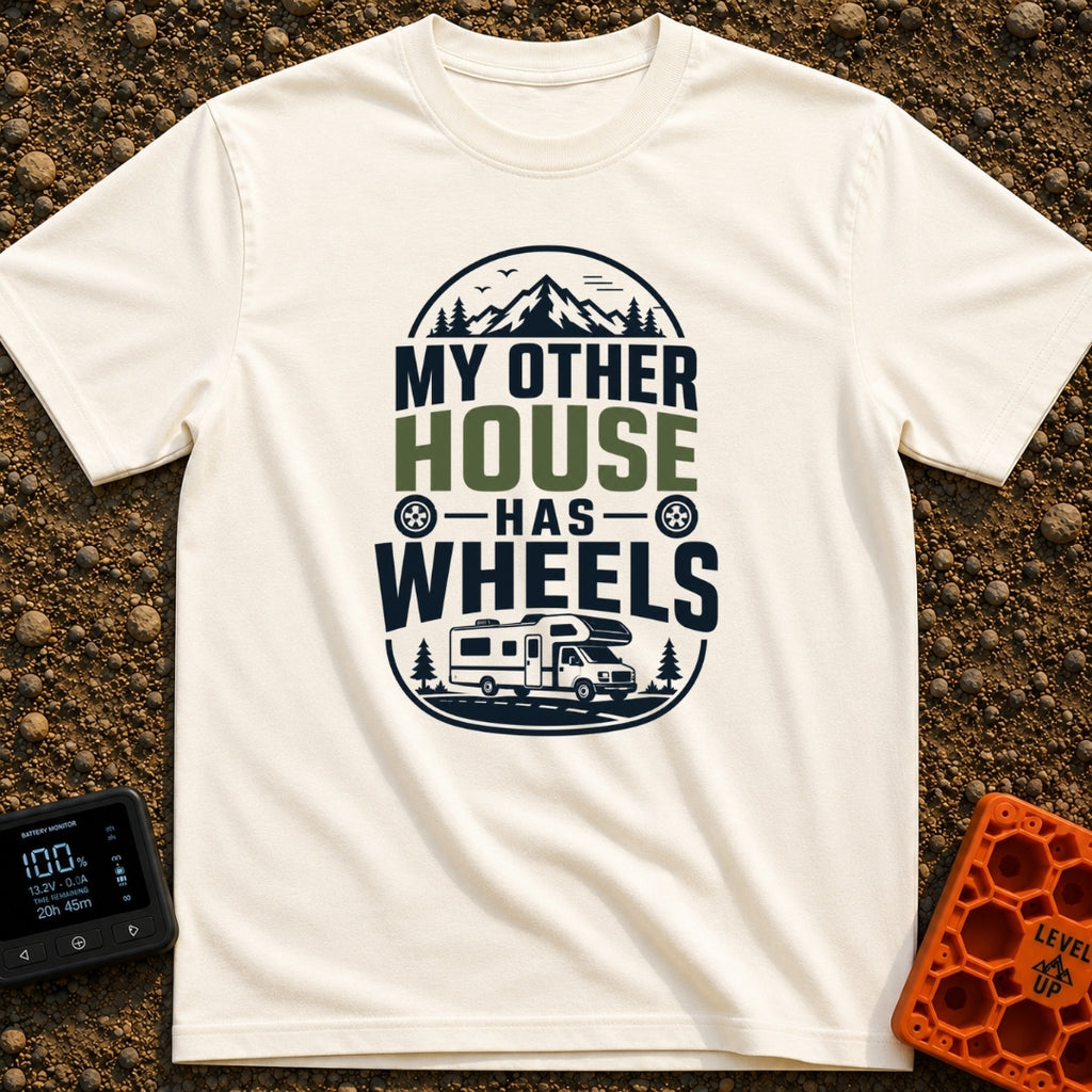My Other House Rolls - T-Shirt in Ivory - A typographic badge design reading 'MY OTHER HOUSE HAS WHEELS' featuring...