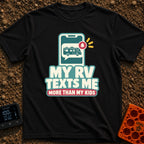 Texts From My RV - T-Shirt in Black - A graphic of a smartphone displaying a chat bubble that contains a motorhome...