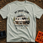 Mud-Covered Smart Home - T-Shirt in Bay - An illustration of a mud-splattered white camper van equipped with a...