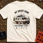 Mud-Covered Smart Home - T-Shirt in Ivory - An illustration of a mud-splattered white camper van equipped with a...