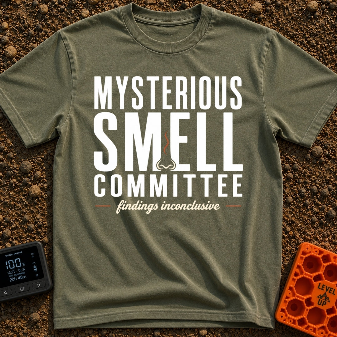 Mysterious Smell Commit - T-Shirt in Moss - The design features the text "MYSTERIOUS SMELL COMMITTEE" in large block...