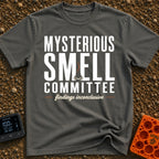 Mysterious Smell Commit - T-Shirt in Pepper - The design features the text "MYSTERIOUS SMELL COMMITTEE" in large block...