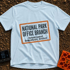Established Somewhere Better - T-Shirt in Chambray - A graphic resembling a distressed rectangular rubber stamp with an...