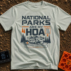 Nature Is My HOA - T-Shirt in Bay - A graphic of a fifth-wheel RV parked in front of a mountain range and pine trees. The...