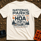 Nature Is My HOA - T-Shirt in Ivory - A graphic of a fifth-wheel RV parked in front of a mountain range and pine trees....