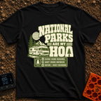 Nature Is My HOA - T-Shirt in Black - A graphic featuring a Class A motorhome parked in front of pine trees, mountains,...