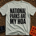 Parks Are My HOA - T-Shirt in Bay - A text-only design featuring the phrase "NATIONAL PARKS ARE MY HOA" in large, bold,...