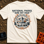 Parks Are My HOA - T-Shirt in Ivory - A graphic emblem featuring a Class C motorhome parked in front of mountains and...