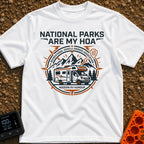 Parks Are My HOA - T-Shirt in White - A graphic emblem featuring a Class C motorhome parked in front of mountains and...