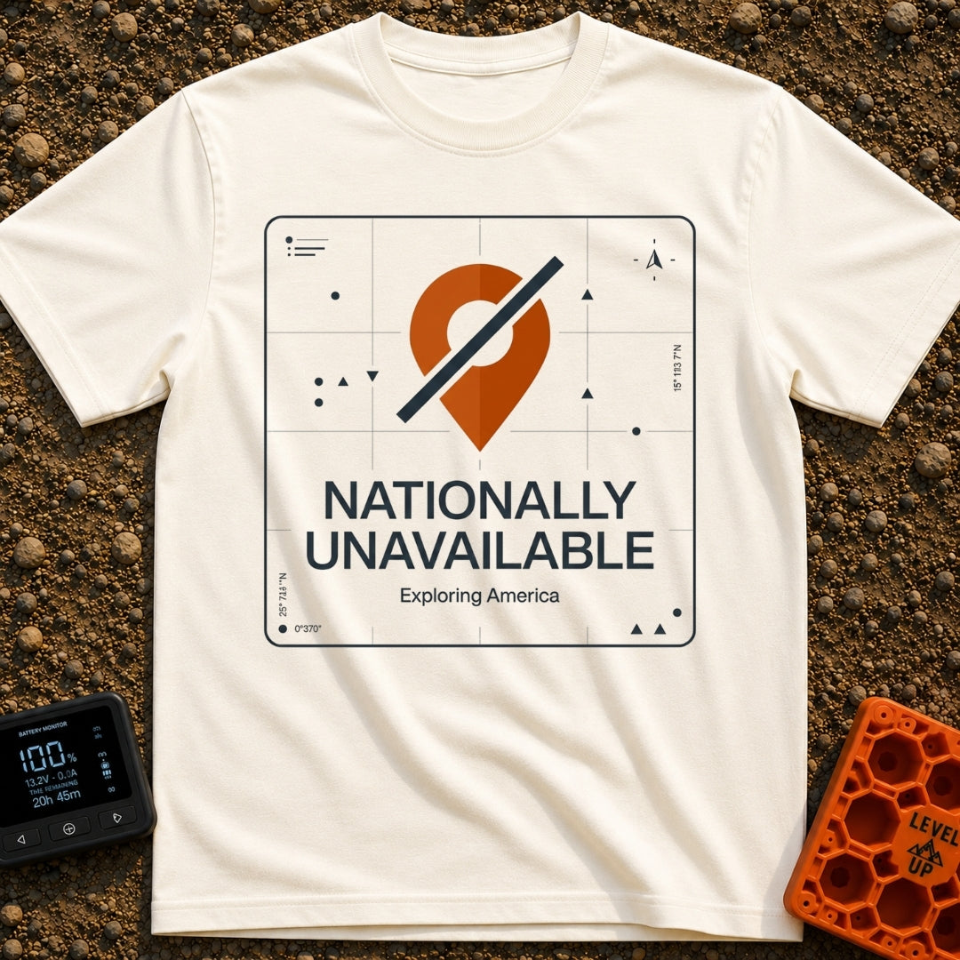 Temporarily Nationally Unavailable - T-Shirt in Ivory - A graphic of an orange map location pin with a dark diagonal...