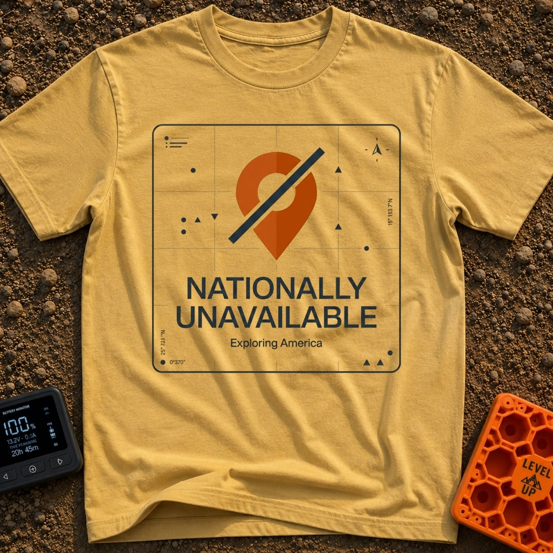 Temporarily Nationally Unavailable - T-Shirt in Mustard - A graphic of an orange map location pin with a dark diagonal...