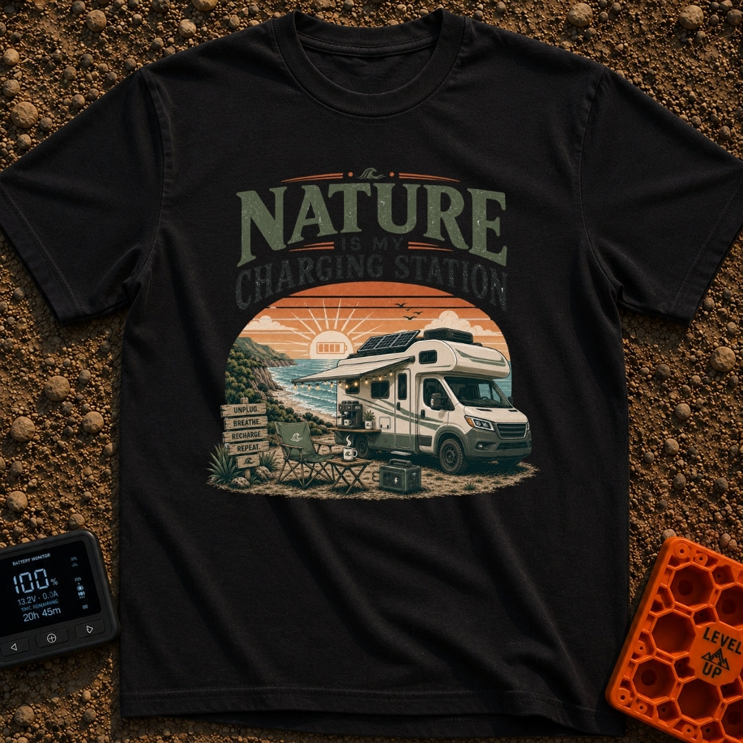 Nature Is My Outlet - T-Shirt in Black - An RV parked on a coastal cliff at sunset, featuring roof-mounted solar panels,...