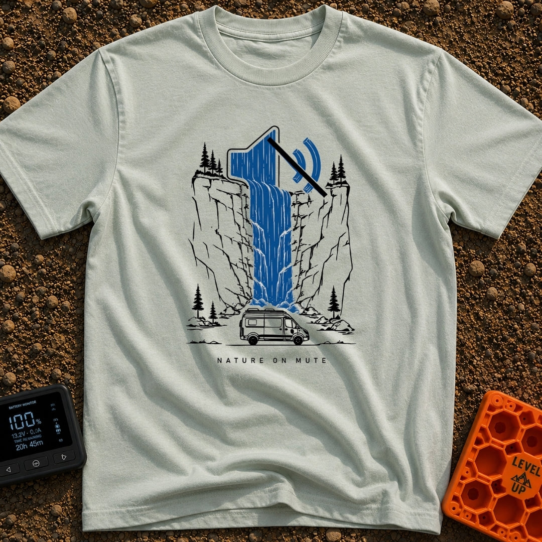 Stream On Mute - T-Shirt in Bay - An illustration of a camper van parked at the base of a steep cliff with pine trees,...