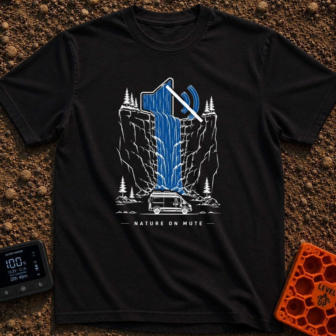 Stream On Mute - T-Shirt in Black - An illustration of a camper van parked at the base of a steep cliff with pine trees,...