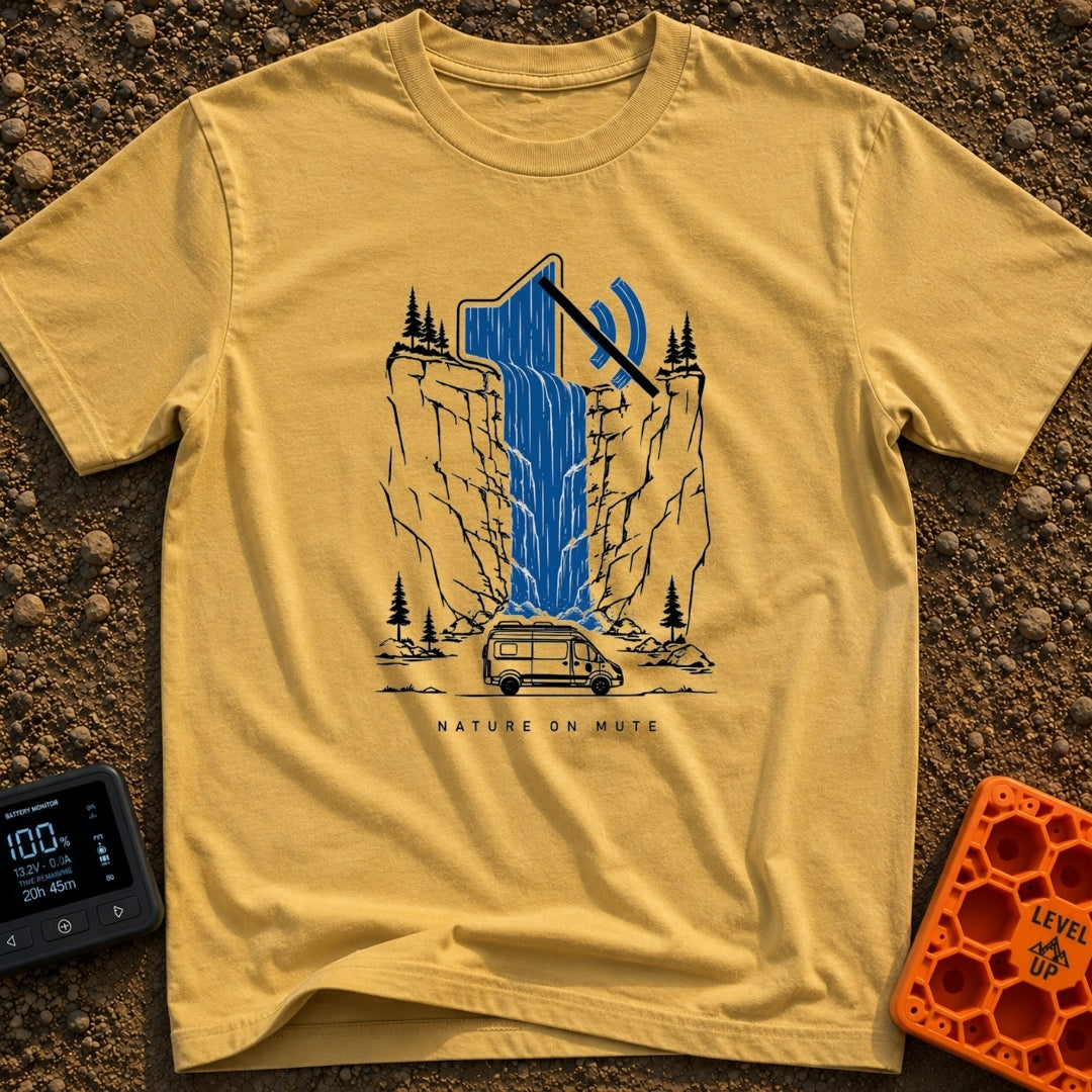 Stream On Mute - T-Shirt in Mustard - An illustration of a camper van parked at the base of a steep cliff with pine...
