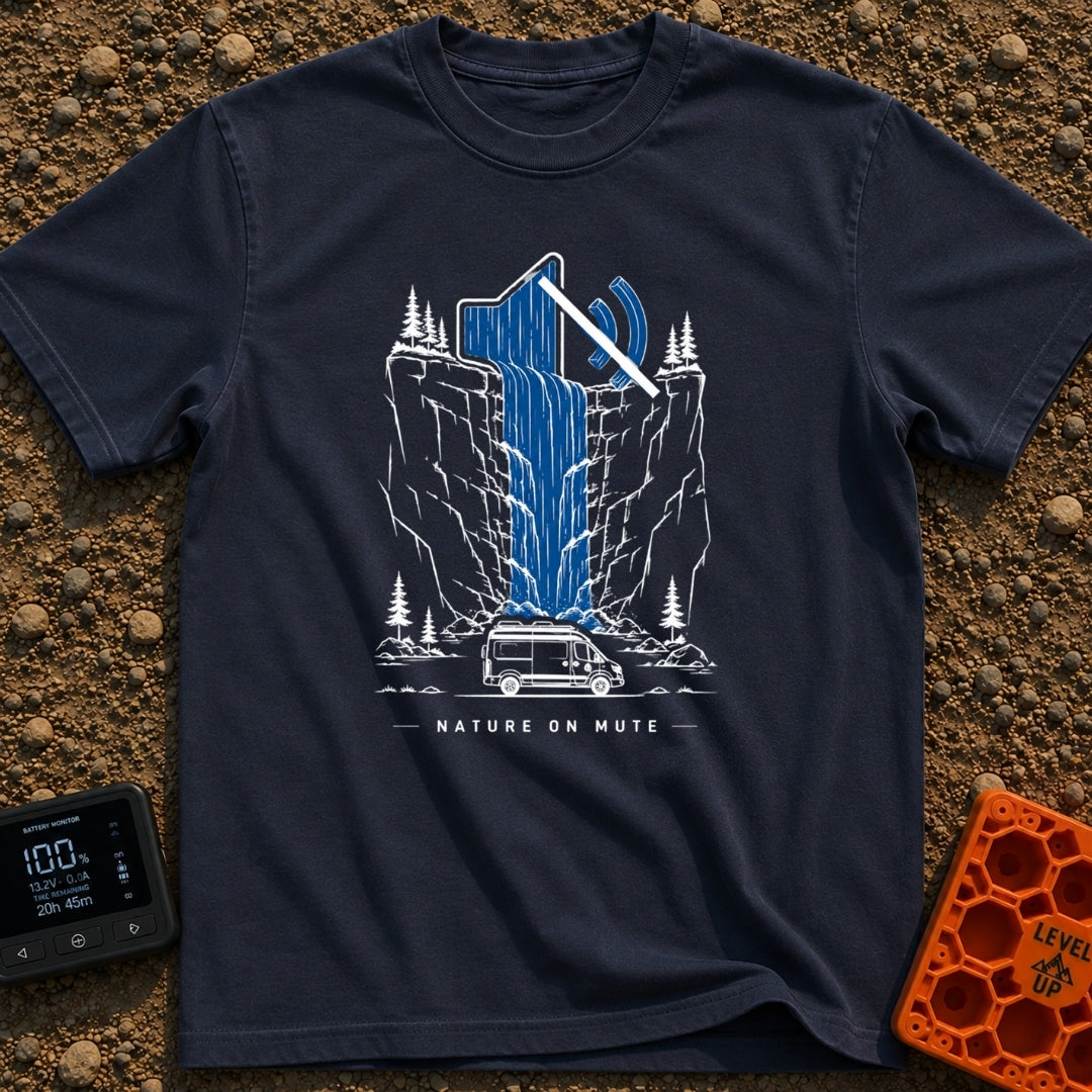 Stream On Mute - T-Shirt in Navy - An illustration of a camper van parked at the base of a steep cliff with pine trees,...