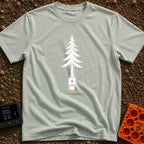 Nature's Port Of Call - T-Shirt in Bay - A black and white line drawing of a pine tree where the lower trunk transforms...