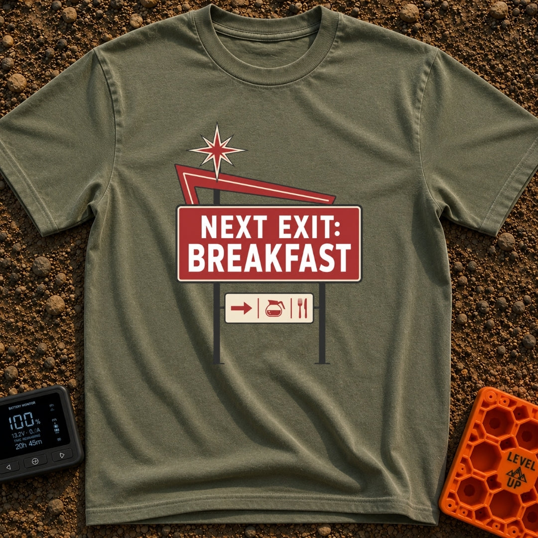 Breakfast Next Exit - T-Shirt in Moss - A vintage-style roadside sign with a red starburst and arrow, featuring a large...