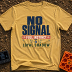 Instinct Meets Loyal Shadow - T-Shirt in Mustard - A typographic design featuring the text "NO SIGNAL" next to a low...