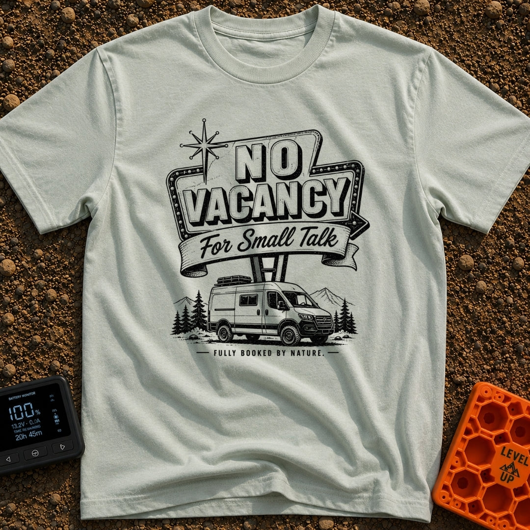 Sorry No Vacancy - T-Shirt in Bay - A black and white line-art illustration of a camper van parked in front of pine trees...