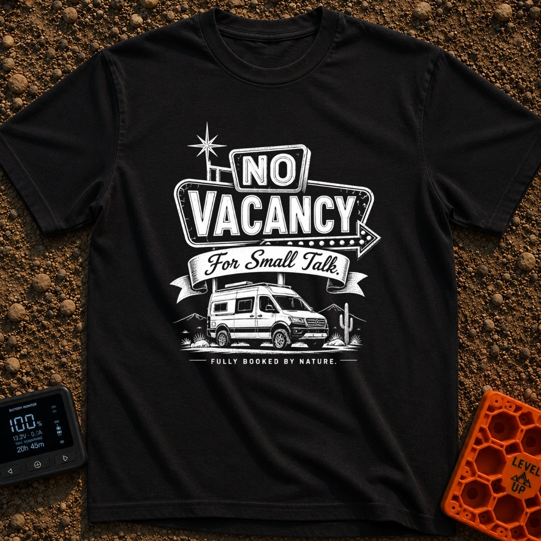Sorry No Vacancy - T-Shirt in Black - A black and white line-art illustration of a camper van parked in front of pine...