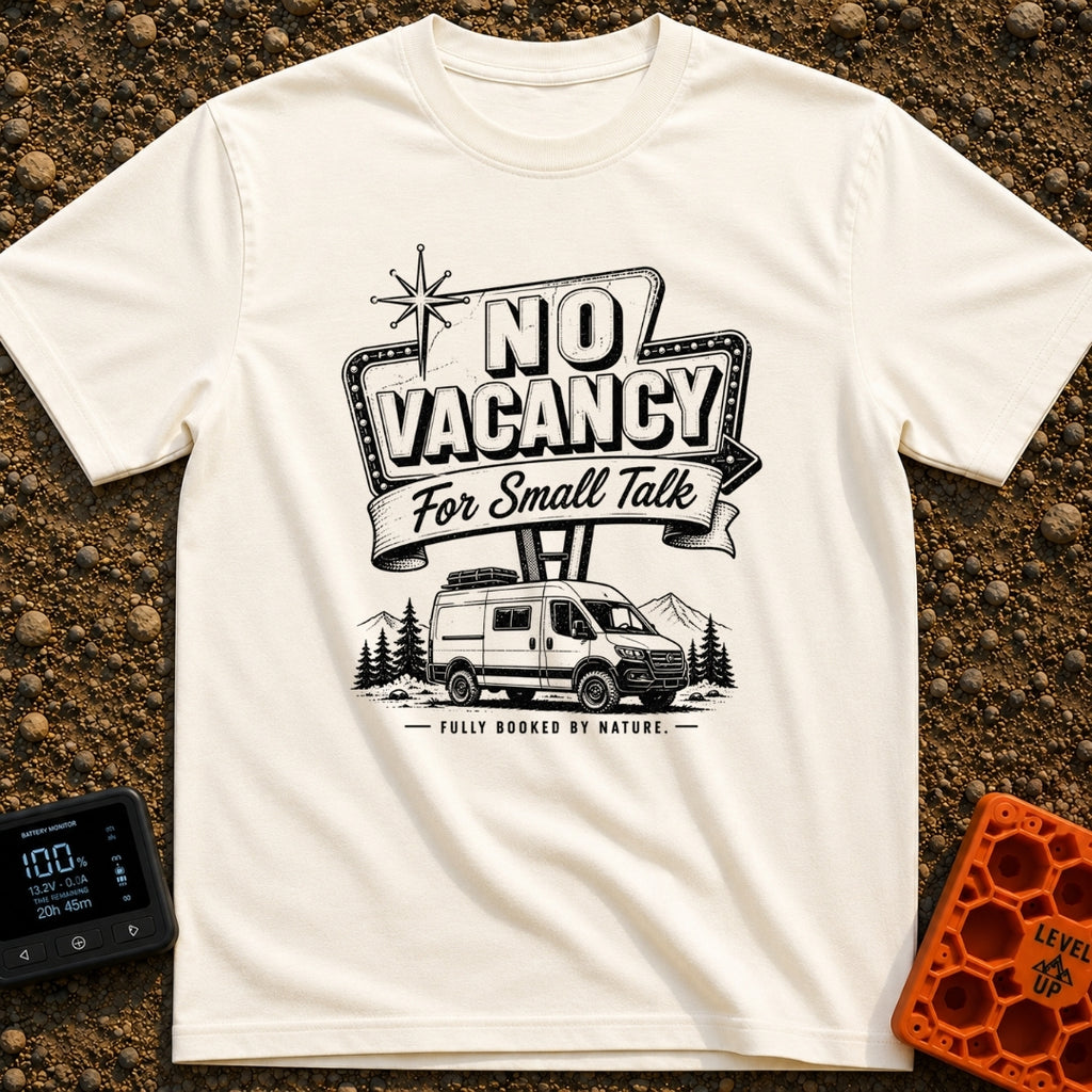 Sorry No Vacancy - T-Shirt in Ivory - A black and white line-art illustration of a camper van parked in front of pine...