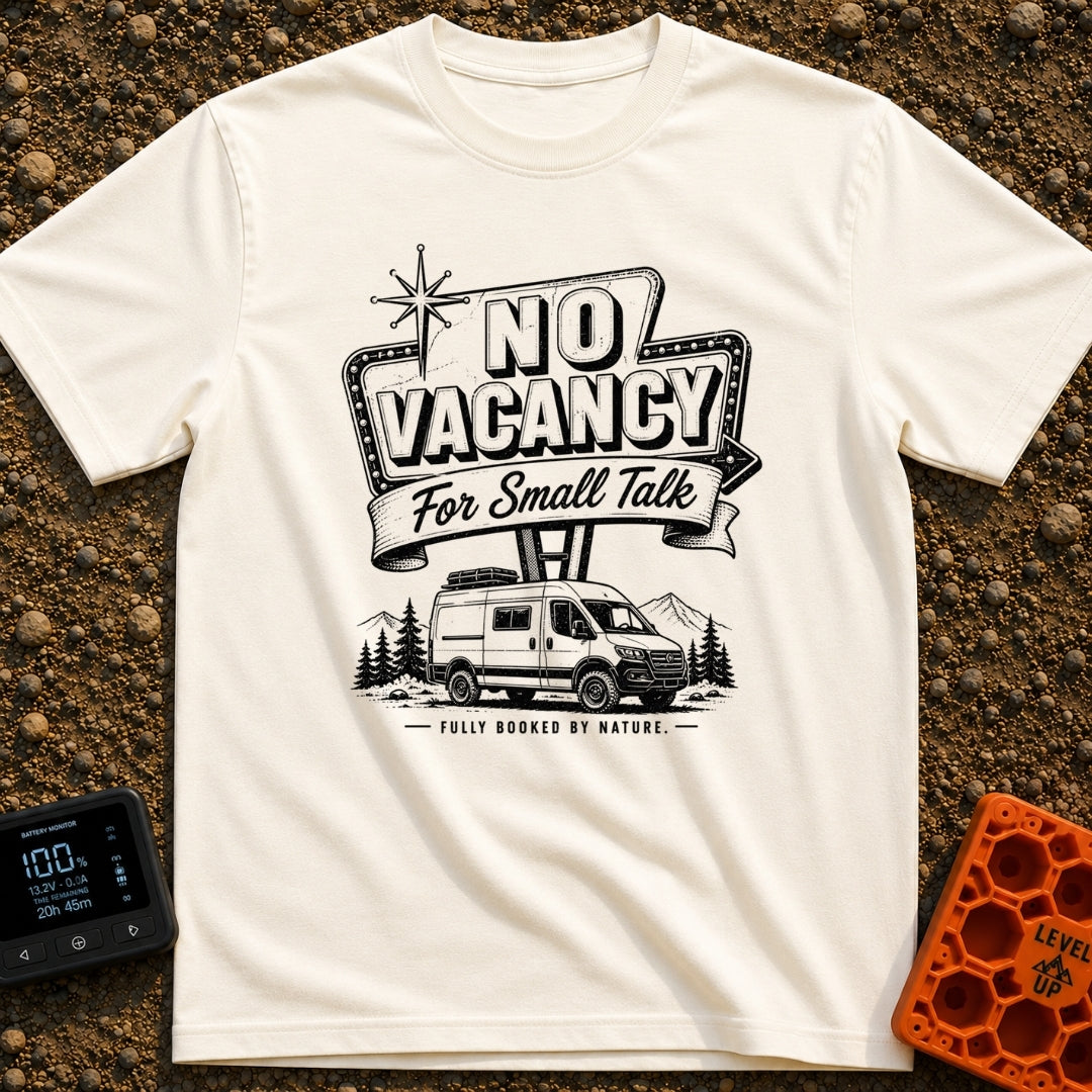 Sorry No Vacancy - T-Shirt in Ivory - A black and white line-art illustration of a camper van parked in front of pine...
