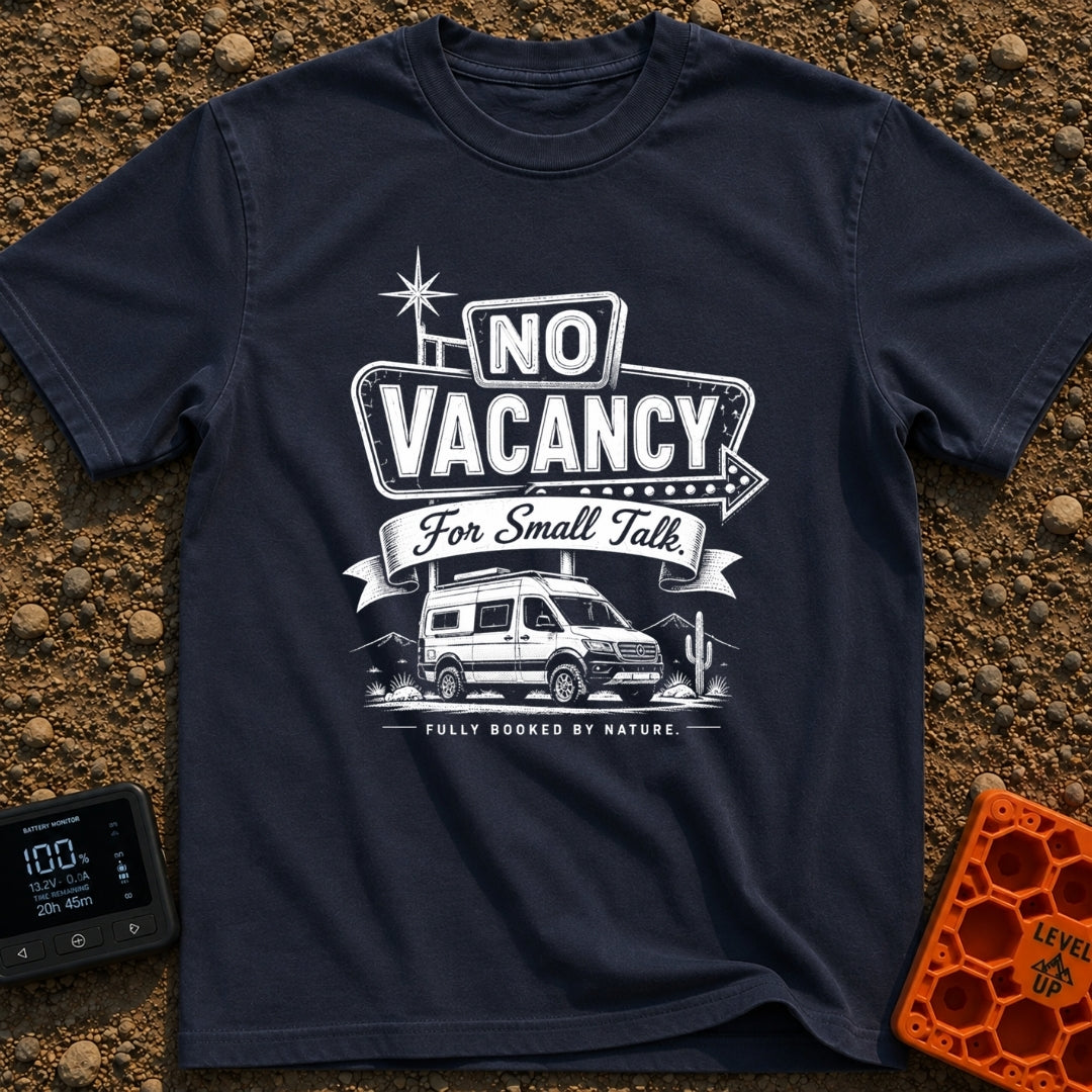 Sorry No Vacancy - T-Shirt in Navy - A black and white line-art illustration of a camper van parked in front of pine...