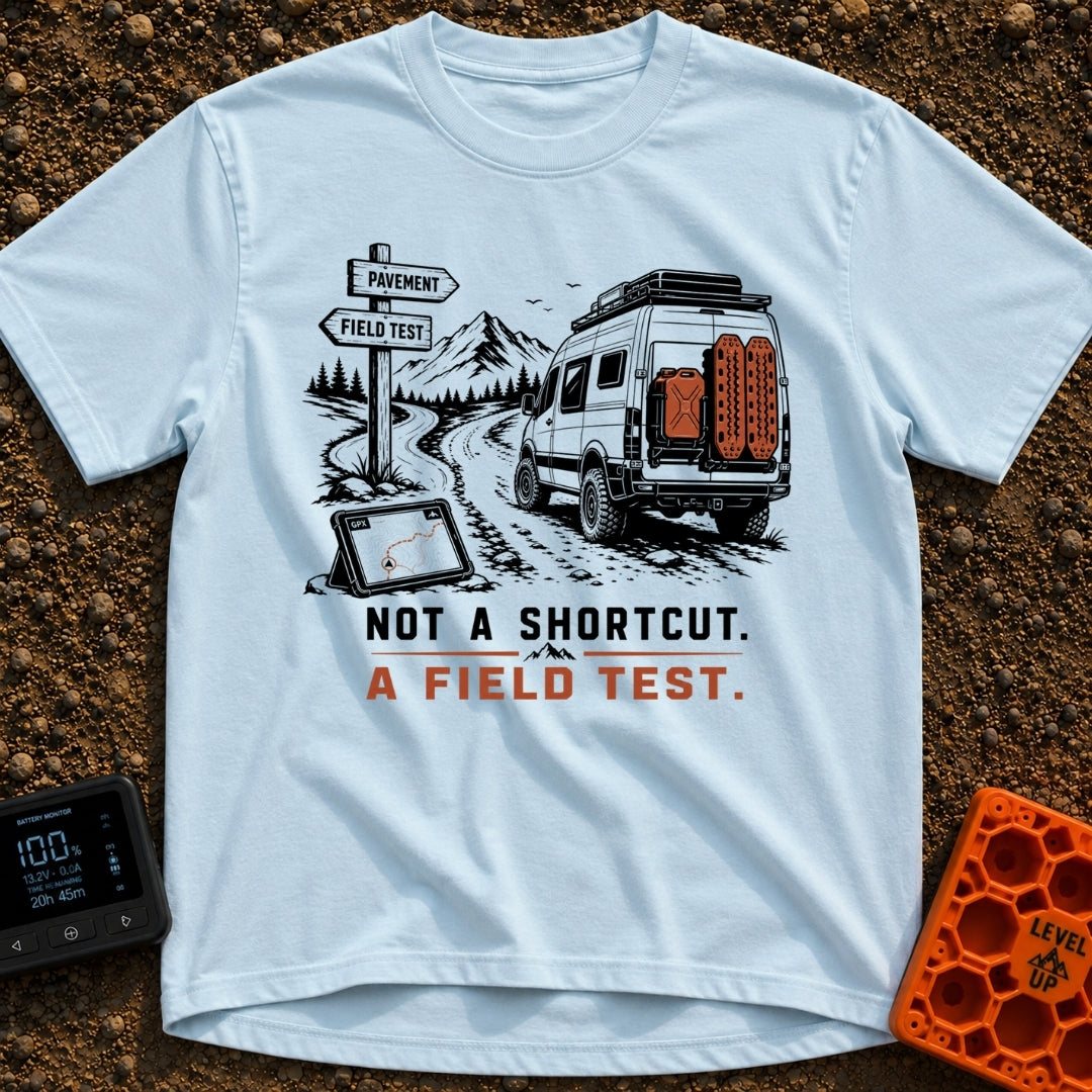 Just A Field Test - T-Shirt in Chambray - An illustration of an off-road equipped camper van with recovery boards driving...