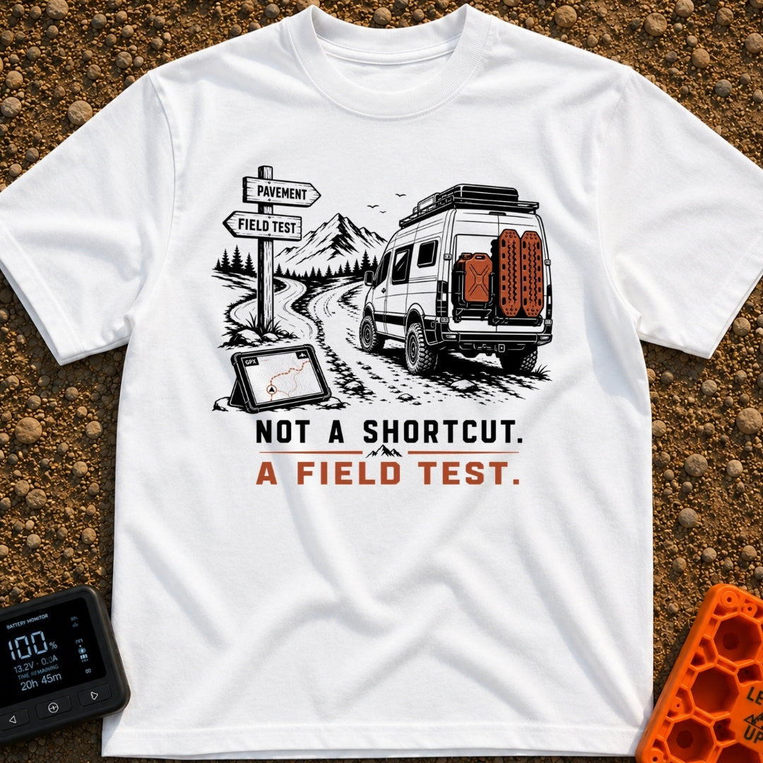 Just A Field Test - T-Shirt in White - An illustration of an off-road equipped camper van with recovery boards driving on...