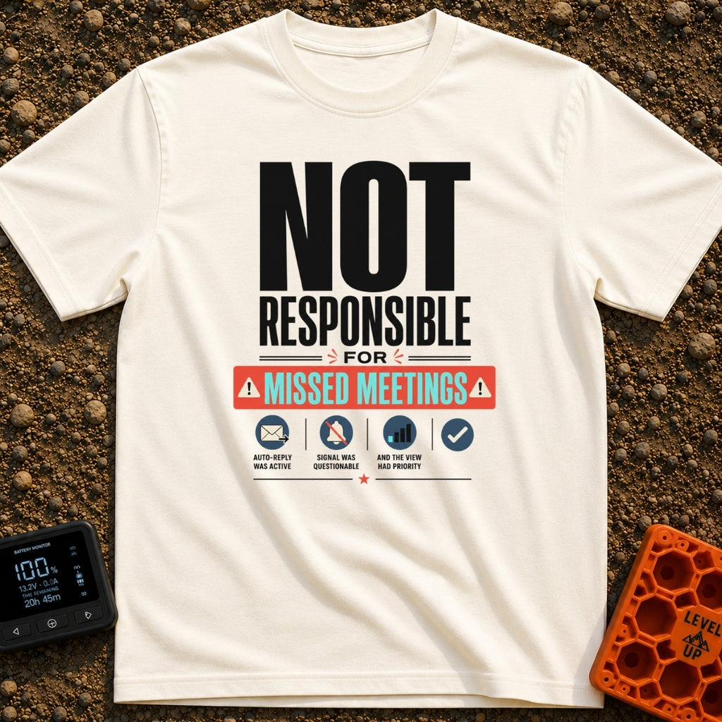 Out of Office Nomad - T-Shirt in Ivory - A bold typographic design reading "NOT RESPONSIBLE FOR MISSED MEETINGS" accented...