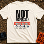 Out of Office Nomad - T-Shirt in Ivory - A bold typographic design reading "NOT RESPONSIBLE FOR MISSED MEETINGS" accented...