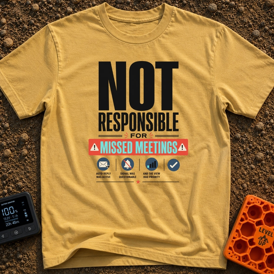 Out of Office Nomad - T-Shirt in Mustard - A bold typographic design reading "NOT RESPONSIBLE FOR MISSED MEETINGS"...