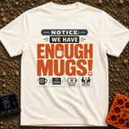 We Have Enough Mugs - T-Shirt in Ivory - A typographic design displaying the text "NOTICE: WE HAVE ENOUGH MUGS!" with a...