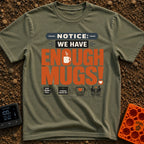 We Have Enough Mugs - T-Shirt in Moss - A typographic design displaying the text "NOTICE: WE HAVE ENOUGH MUGS!" with a...
