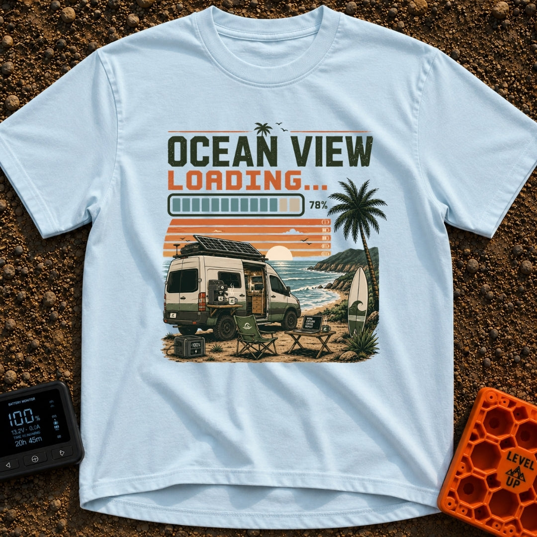 Ocean View Loading - T-Shirt in Chambray - A camper van is parked by the ocean at sunset with a roof-mounted solar panel...